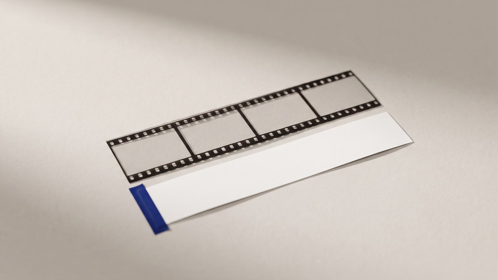 A film strip with a blank caption bar beneath it